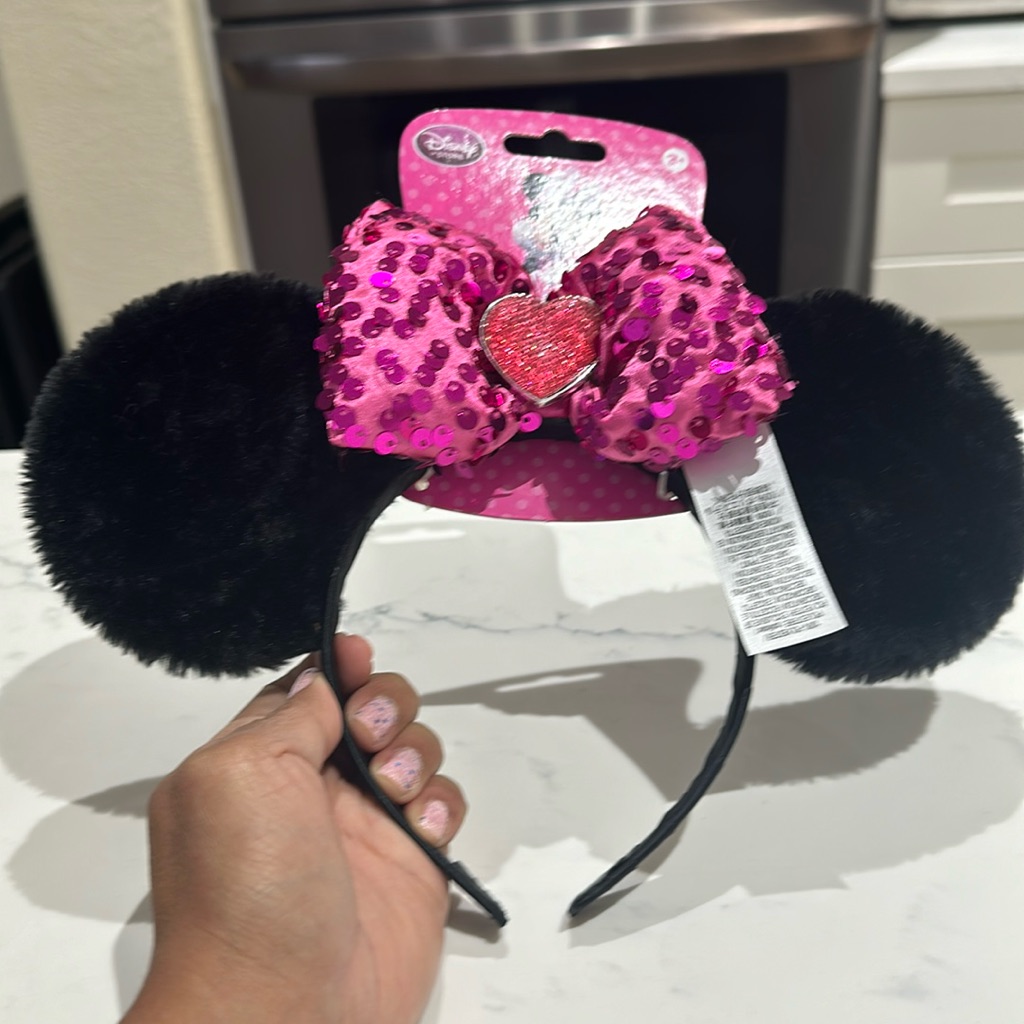 A Minnie Mouse tiara ears headband photographed for a US resale marketplace listing